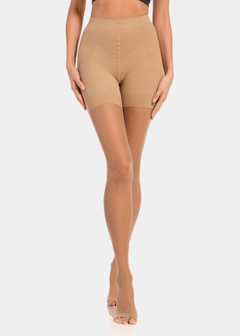 Front view close-up of a model wearing Summer Tights in sunkissed, 20 denier shaping tights with open toe styling. Built-in firm shaping short visible, showing control for tummy, hips, and upper legs, with subtle lift at the bottom.