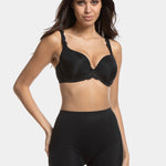 A woman wearing a black maxi sexy short that shapes the lower tummy, hips, and thighs. The short has silicone trim at the leg openings and a seamless edge for an invisible look.