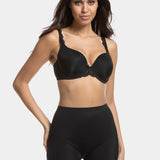 A woman wearing a black maxi sexy short that shapes the lower tummy, hips, and thighs. The short has silicone trim at the leg openings and a seamless edge for an invisible look.