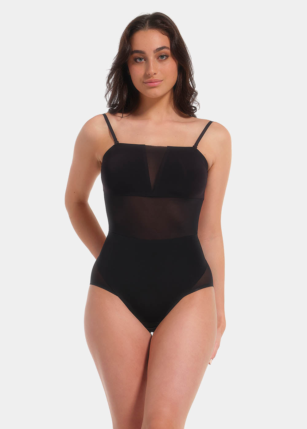 Front view of a model wearing Sheer & Sexy Shaping Body in black, low-back figure-sculpting bodybriefer. Smooth fabric with sheer mesh panels, medium shaping for tummy and lower back, adjustable and removable straps, and hook-and-eye closure at the gusset visible.