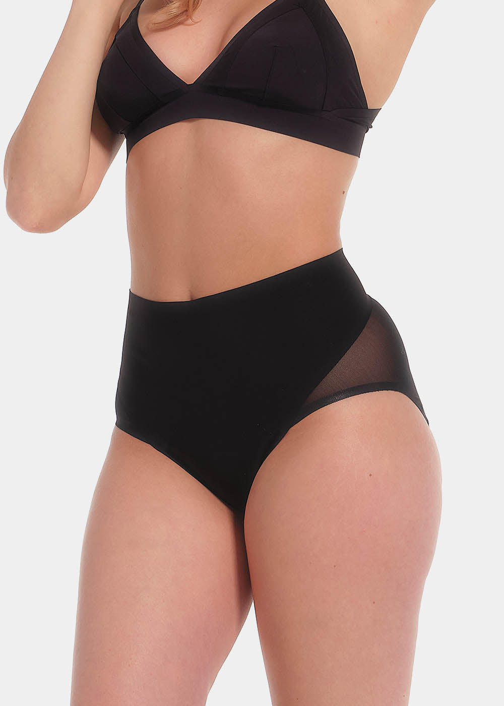 Front view cropped image of a model wearing Sheer & Sexy Brief in black, mid-waist shaping brief. Smooth fabric with sheer mesh panels, medium shaping for tummy and lower back, and special lift zone at the buttocks visible.
