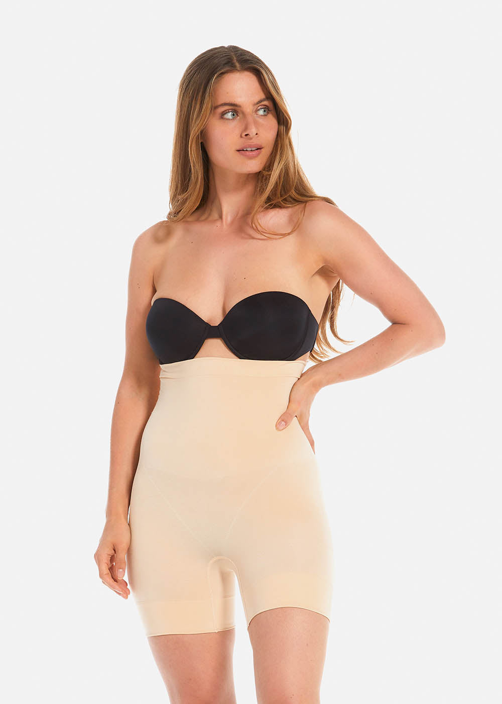 Front view of a second model wearing Comfort Shaper in latte, high-waist seamless shaping shorts. Smooth stretchable fabric with medium shaping for tummy, waist, back, and thighs, featuring silicone trim at waistband and leg openings and a power zone to lift the bottom.