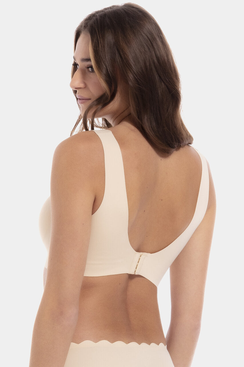 This image shows a model wearing the Scallop Bra. Shown from the rearview