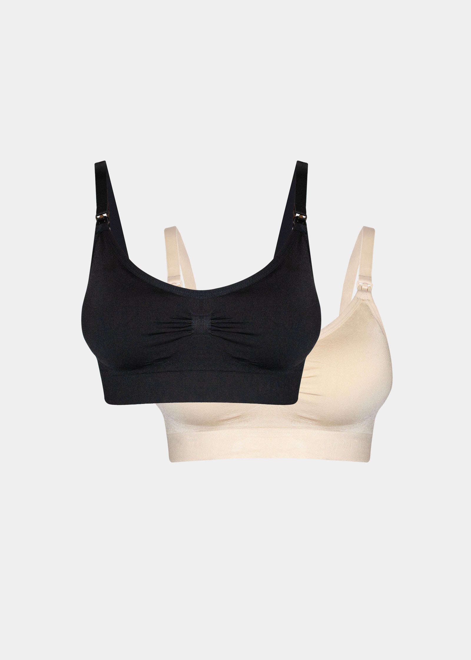 Still product image of Mama Comfort Nursing Bra in black and latte, seamless wire-free nursing bras. Two bras shown flat with adjustable straps, clip-down cups, and smooth stretchable fabric visible.