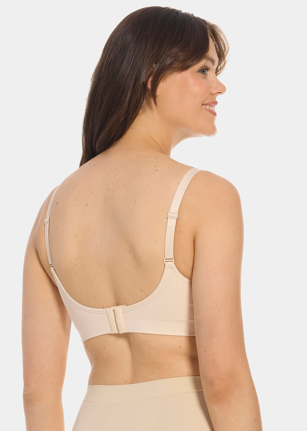 Back view of a model wearing Mama Comfort Nursing Bra in latte, seamless wire-free nursing bra. Adjustable straps and hook-and-eye closure visible, with smooth stretchable fabric and straight back design.