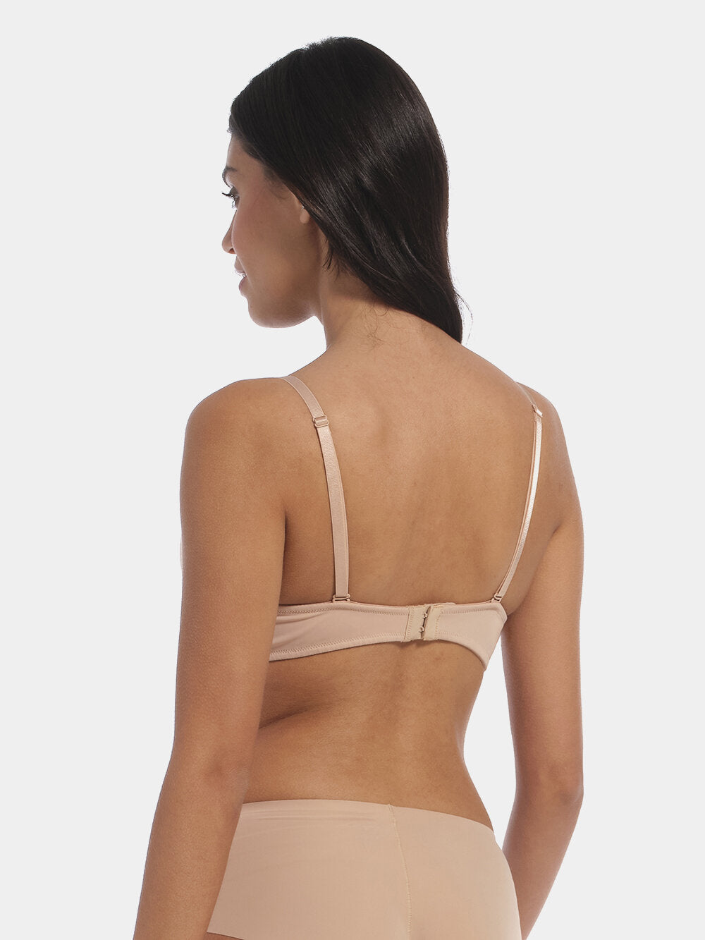 This image features a model wearing a V-Bra, which is designed to be nearly invisible under clothing with low plunge necklines. The bra boasts a deep cleavage front and an extra low back, making it ideal for seamless coverage.