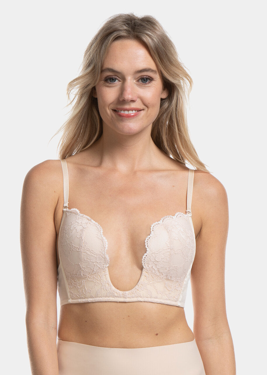 This image features the V-Bra Lace, a stylish and functional bra designed with a deep plunge neckline and an extra low back, making it invisible under sheer tops and dresses. The bra is beautifully crafted with intricate lace and mesh details, adding a touch of elegance.