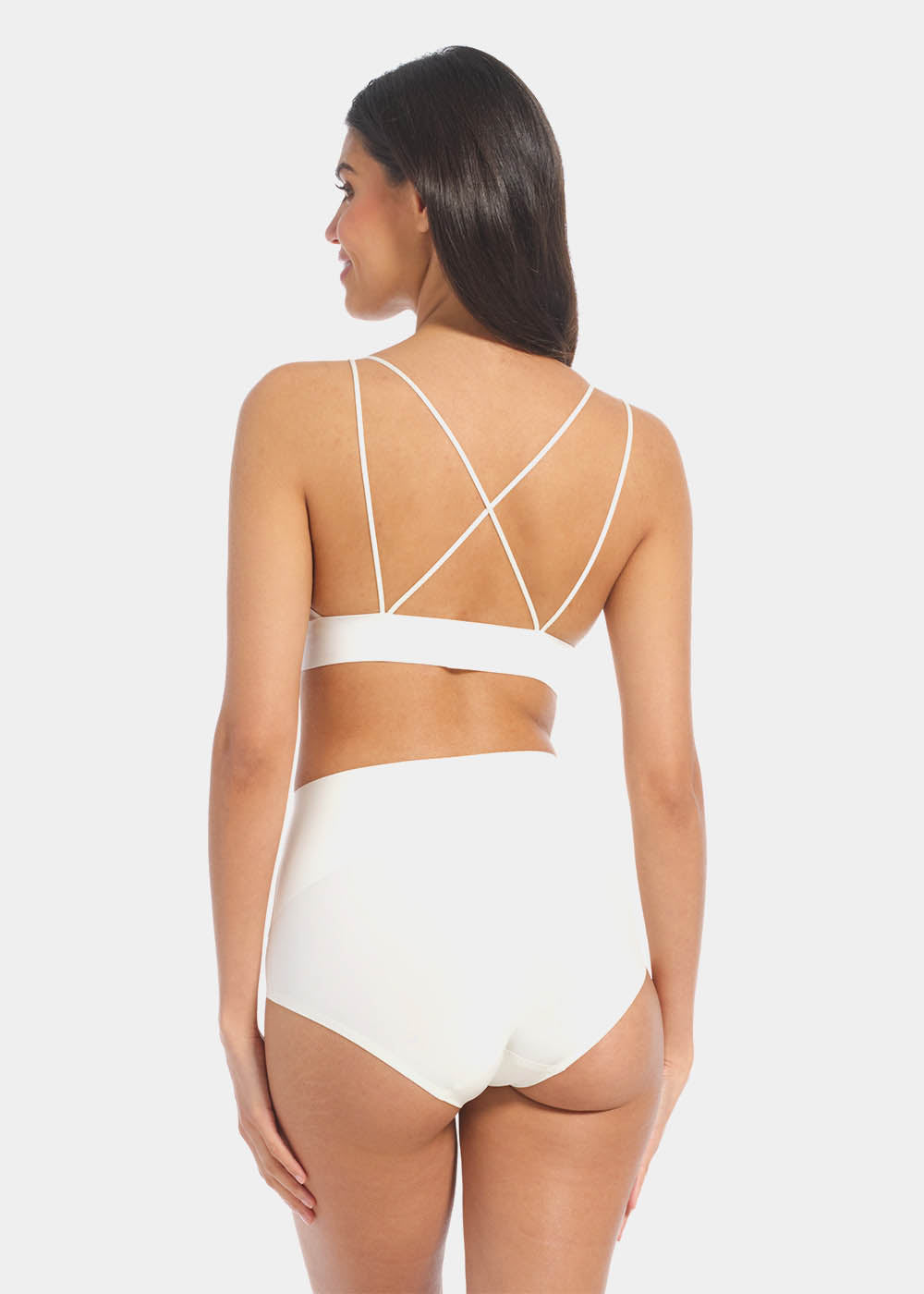 Back view of a model wearing Tummy Shaper in barista, mid-waist shaping brief with seamless design. Smooth fabric with full back coverage and invisible edges, providing firm shaping at the lower back.