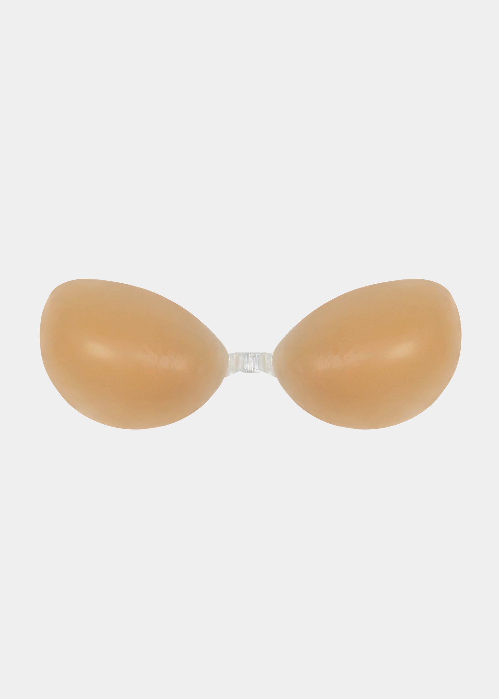 Still product image of Amazing Bra in latte, strapless adhesive silicone bra with two seamless cups and center front closure. Smooth matte finish with curved cup shape and no straps or back band visible.