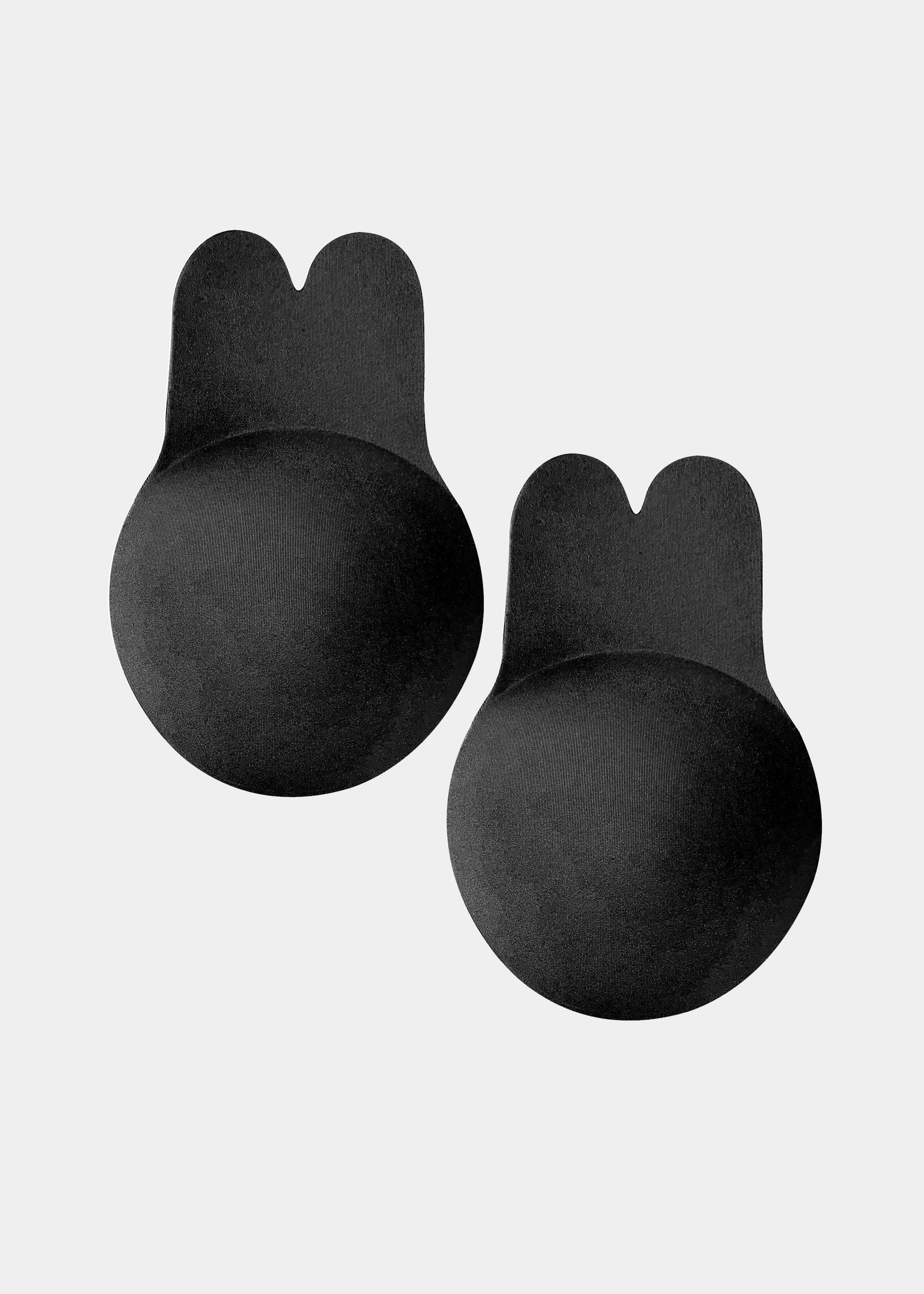 Still product image of the black Lift Covers, showcasing the smooth lifting nipple covers with adhesive support tabs designed to lift and support the bust with an invisible finish.