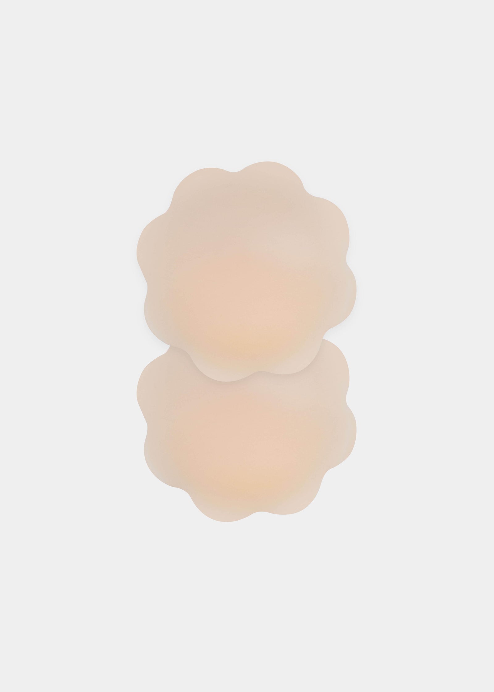Still product image of Flower Nipples in latte, flower-shaped silicone nipple covers shown overlapping. Soft matte silicone covers with smooth edges, seamless finish, and no visible adhesive, designed to cover the nipple area.