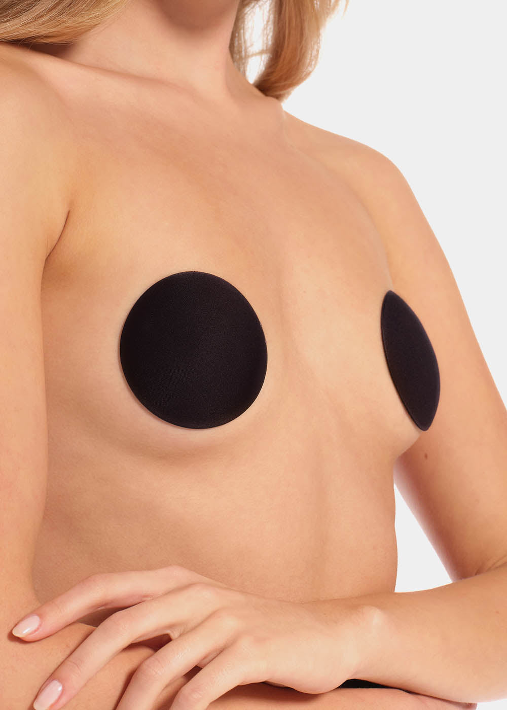 Front view of a model wearing the black MAGIC Hide Your Nipples covers, showcasing the soft fabric nipple covers that provide smooth, discreet coverage with a natural, invisible look under clothing.