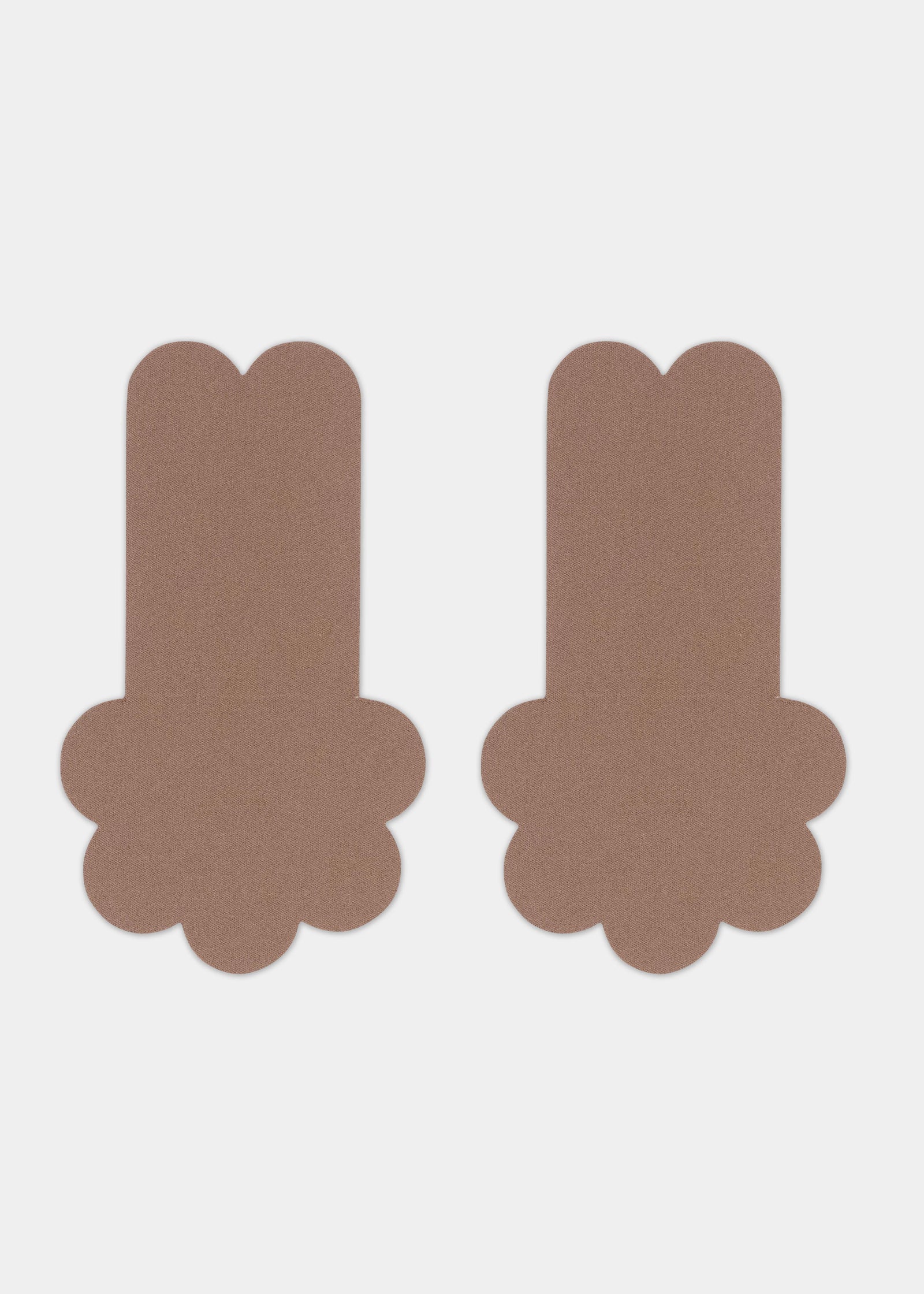 Still front product view of the mocha-colored Secret Lift Covers, showcasing the thin lifting nipple covers with adhesive support tabs and a smooth outer surface for an invisible finish.