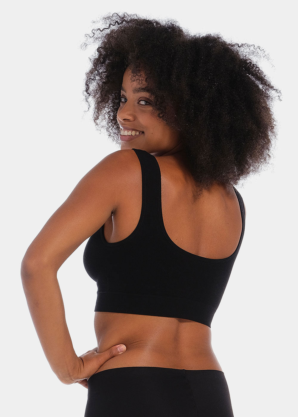 Woman wearing a black Bamboo Comfort Bra against a white background