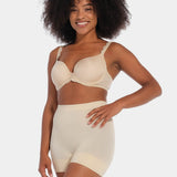 A person wearing a black comfort short that reaches mid-thigh, made of a smooth, solid fabric.