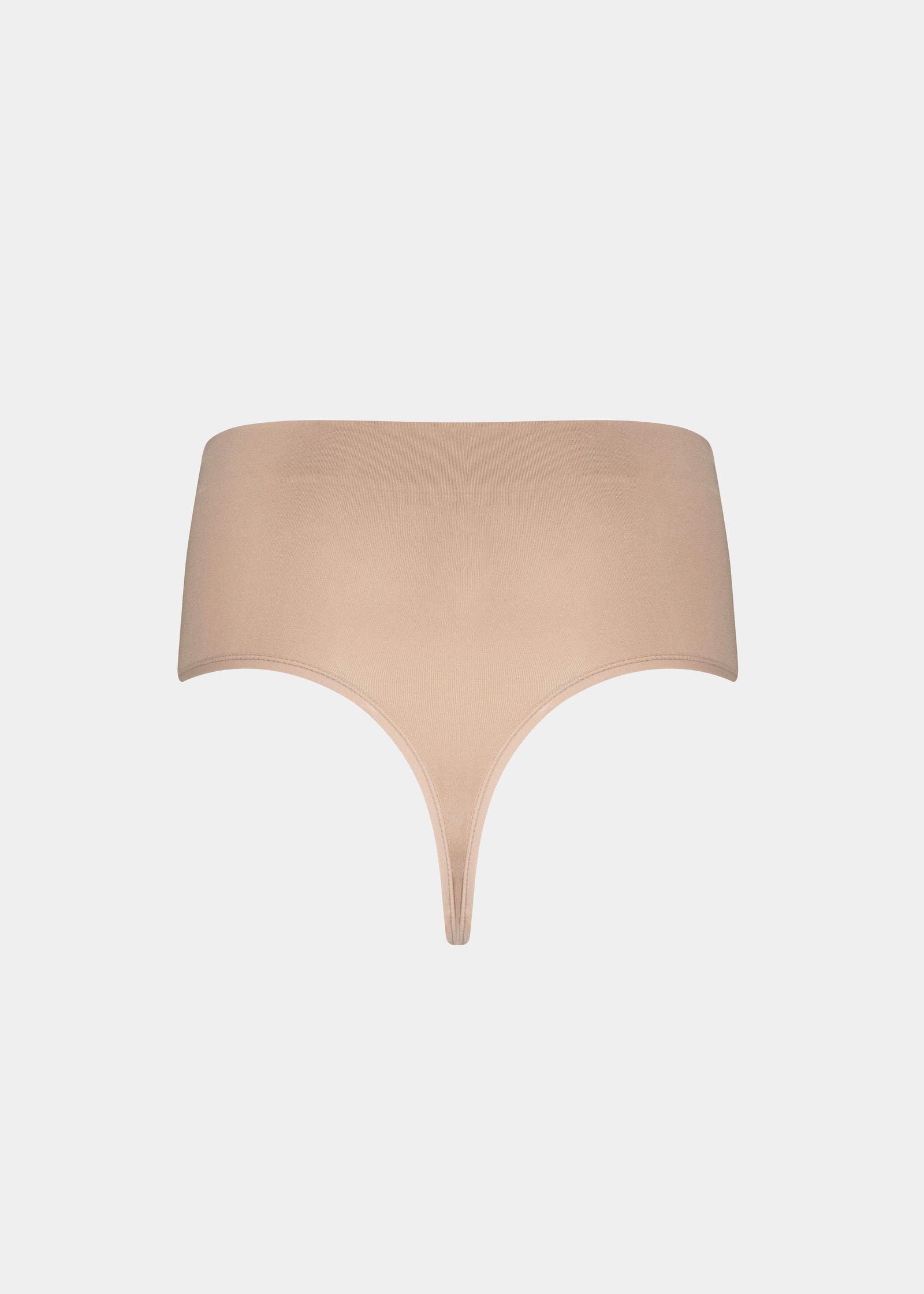 Still back product view of the cappuccino Comfort Thong, showcasing the seamless, lightweight fabric, smooth edges, and clean, minimal design for an invisible finish.