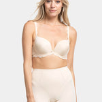 A person wearing a beige Dream Shaper Short that reaches mid-thigh, designed for shaping the lower back, tummy, and upper legs.