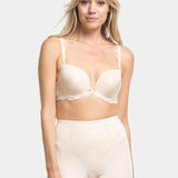 A person wearing a beige Dream Shaper Short that reaches mid-thigh, designed for shaping the lower back, tummy, and upper legs.