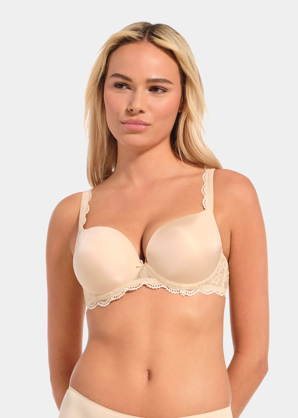 Woman wearing a latte Luxury Gel Bra against a plain background