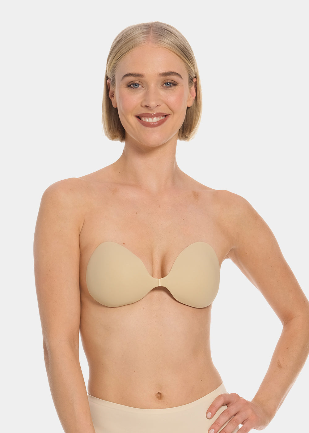 Woman wearing a latte strapless My MAGIC Bra against a white background