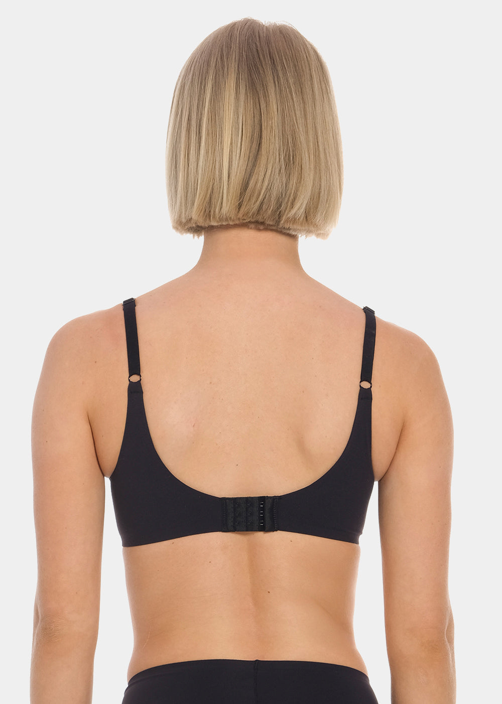 Person wearing a black MAGIC Push-Up Bra on a white background