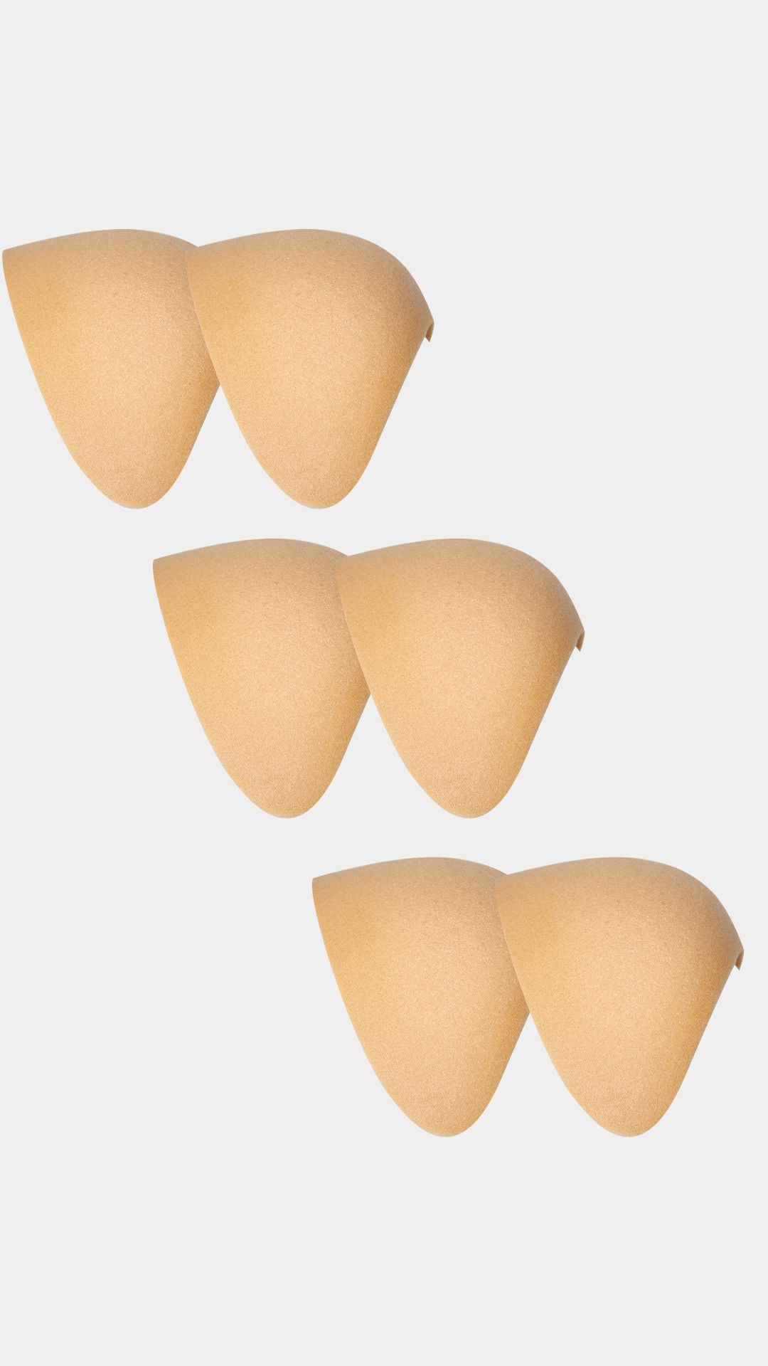 Set of beige silicone shoulderpads on a white background