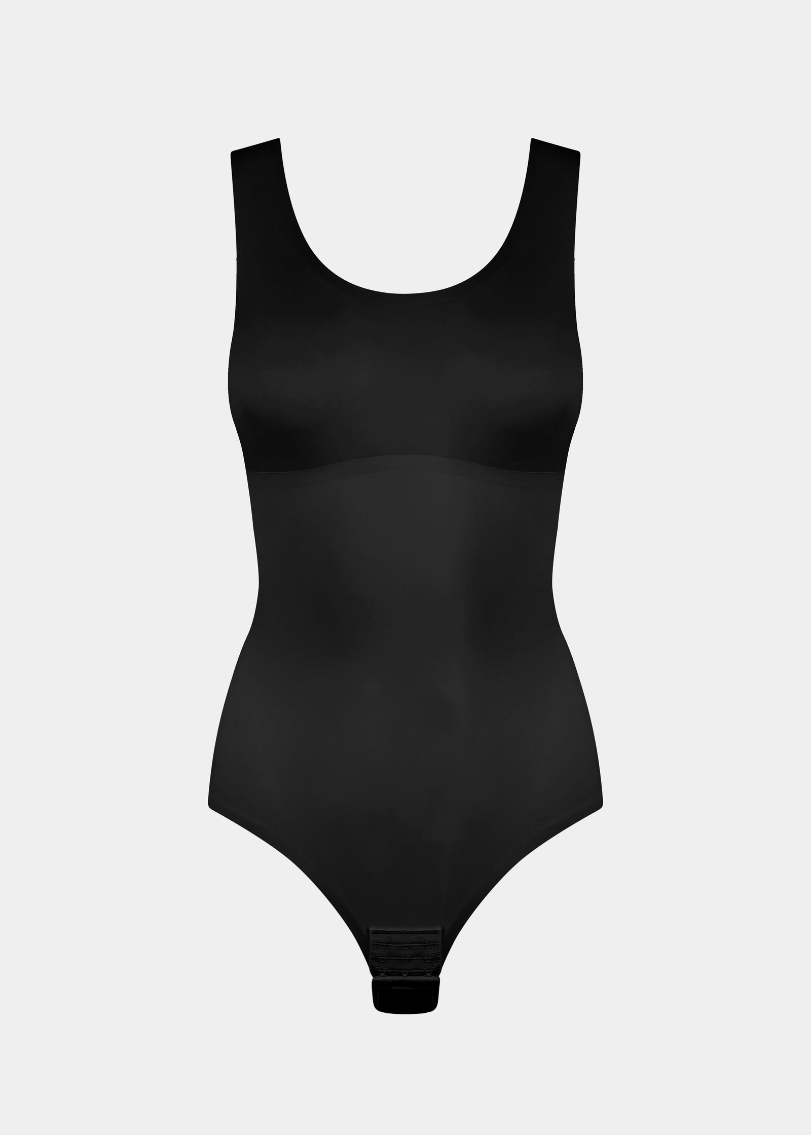 Still product image of Tone Your Body Briefer in black, sleek body-contouring briefer. Smooth powerful recycled fabric providing firm shaping for tummy, waist, and back, with seamless edges, free bust area, smooth shoulders, and hook closure visible.