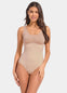 Front view of a model wearing Tone Your Body Briefer in cappuccino, sleek body-contouring briefer. Smooth powerful recycled fabric providing firm shaping for tummy, waist, and back, with seamless edges, free bust area, smooth shoulders, and hook closure visible.