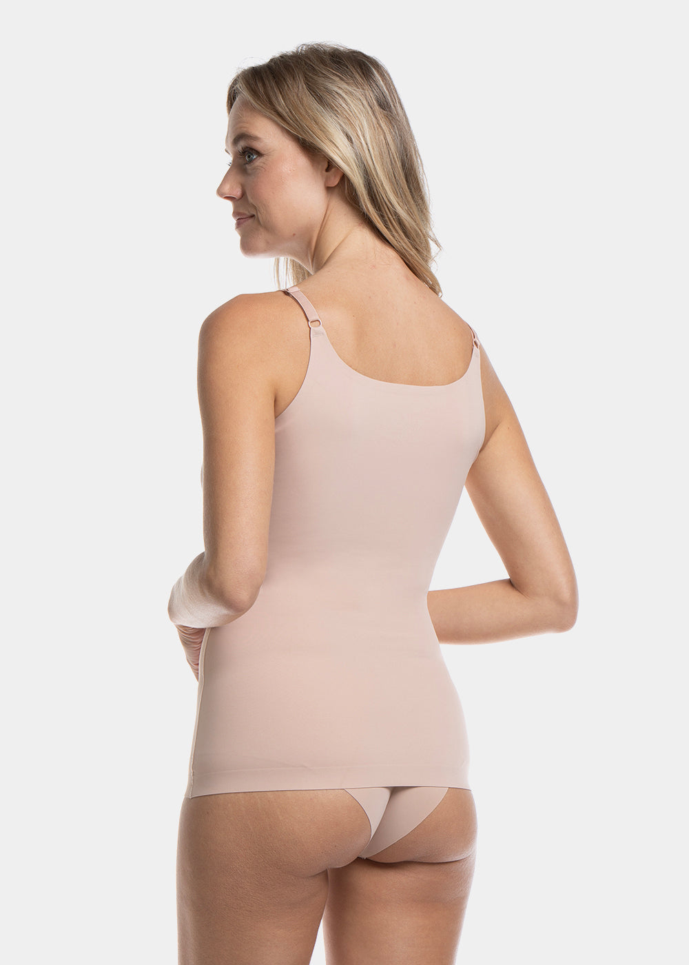 Back view of a model wearing Tone Your Body Cami in cappuccino, body-contouring sleek cami. Smooth powerful recycled fabric providing firm shaping for lower back and waist, seamless edges, and adjustable spaghetti straps visible.