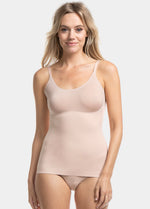 Front view of a model wearing Tone Your Body Cami in cappuccino, body-contouring sleek cami. Smooth powerful recycled fabric providing firm shaping for tummy, waist, and back, with seamless edges, no shaping at the bust, and adjustable spaghetti straps visible.