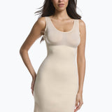Front view of a model wearing Tone Your Body Dress in latte, body-contouring tank dress. Smooth powerful recycled fabric providing firm shaping for upper body, hips, and legs, with seamless edges, smooth shoulders, and silicone-lined leg openings visible.