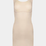 Still product image of Tone Your Body Dress in latte, body-contouring tank dress. Smooth powerful recycled fabric providing firm shaping for upper body, hips, and legs, with seamless edges, smooth shoulders, and silicone-lined leg openings visible.