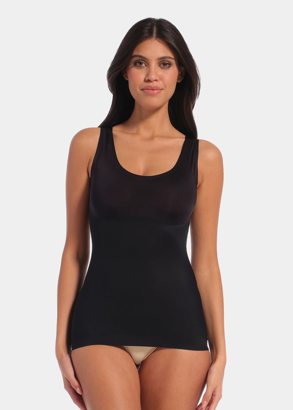 Black shaping tanktop worn by a model in a front-facing standing position, featuring firm tummy, waist, and back shaping, seamless invisible finish, smooth shoulder straps, and strong recycled fabric with non-compression bust area.
