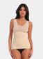 Latte shaping tanktop worn by a model in a front-facing standing position, featuring firm tummy, waist, and back shaping, seamless invisible finish, smooth shoulder straps, and strong recycled fabric with non-compression bust area.
