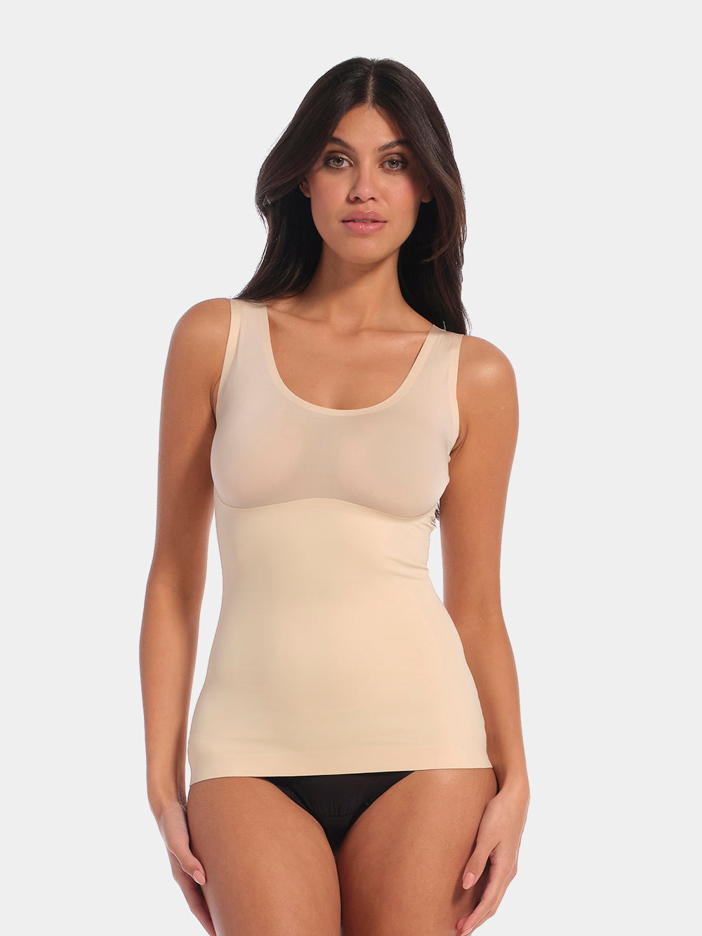 Latte shaping tanktop worn by a model in a front-facing standing position, featuring firm tummy, waist, and back shaping, seamless invisible finish, smooth shoulder straps, and strong recycled fabric with non-compression bust area.