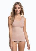 Cappuccino shaping tanktop worn by a model in a front-facing standing position, featuring firm tummy, waist, and back shaping, seamless invisible finish, smooth shoulder straps, and strong recycled fabric with non-compression bust area.