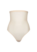 Still product image of MAGIC Ultra Thin Power Thong in latte, high-waist shaping thong. Smooth breathable fabric providing light shaping for tummy, waist, and back, with seamless edges for invisible wear under clothing.