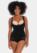 Woman wearing a black bodysuit with a beige bralette on a white background