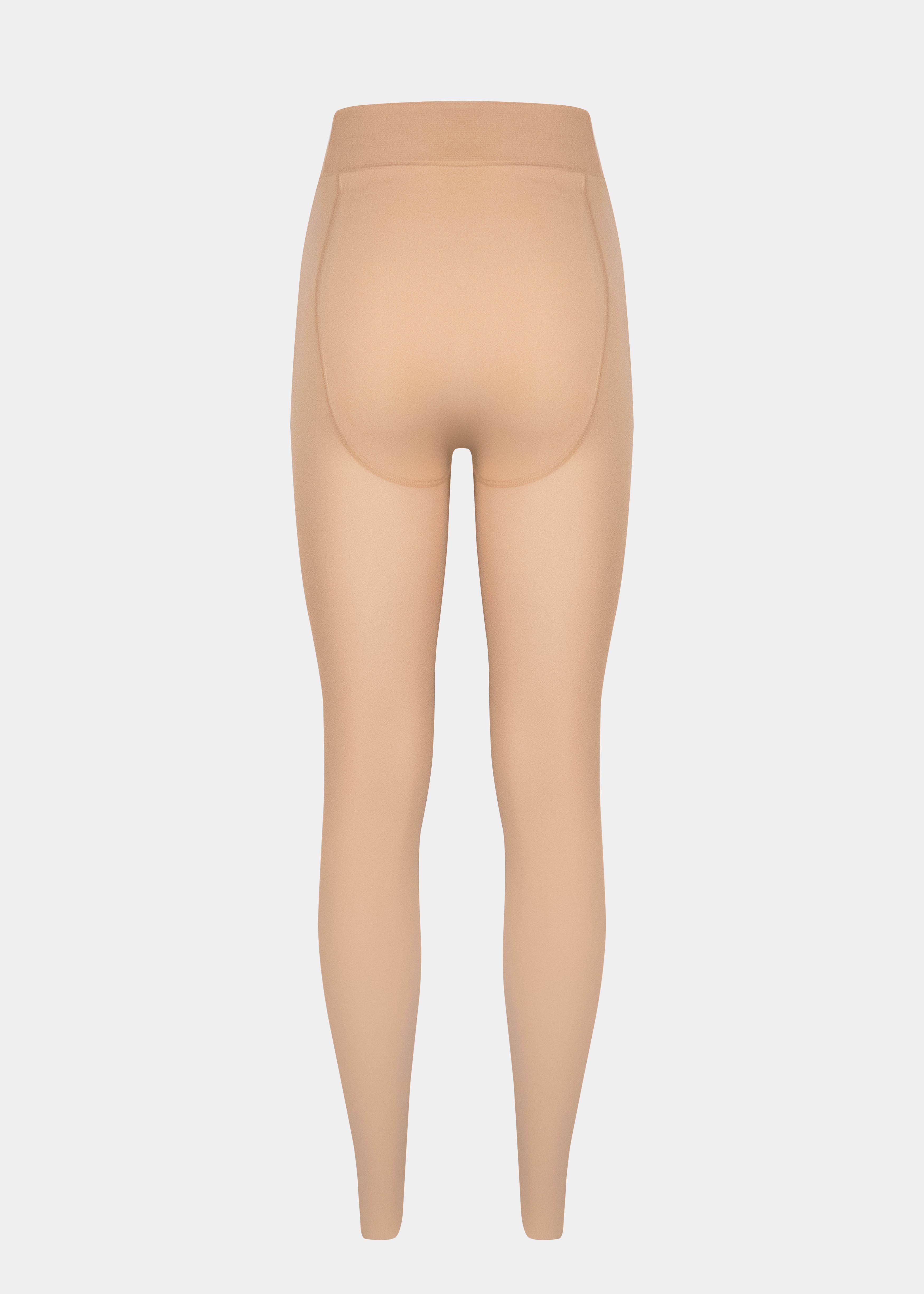 Still product image of MAGIC Tights in latte shown from the back. High-waist warm fleece-lined tights with smooth fabric providing medium shaping for lower back and waist, ladder-resistant finish, and sheer-look legs with unfleece foot section visible.