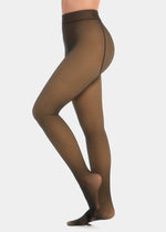 Black magic tights worn by a model on a light grey background