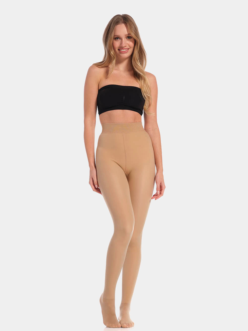 A model wearing high-waisted, fleece-lined brown tights with a sheer appearance. She is also wearing a black bra.