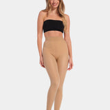 A model wearing high-waisted, fleece-lined brown tights with a sheer appearance. She is also wearing a black bra.
