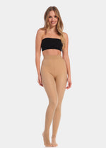 A model wearing high-waisted, fleece-lined brown tights with a sheer appearance. She is also wearing a black bra.