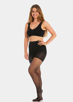 Front view of a model wearing Sexy Dots shaping tights in black, 20 denier sheer tights with dot pattern. Built-in firm shaping shorts providing control for tummy, hips, and upper legs, with subtle lift at the bottom and reinforced toes visible.