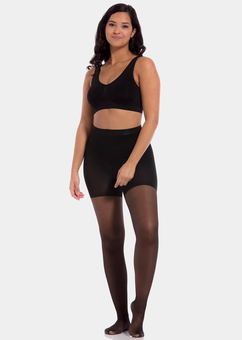 Front view of a model wearing Sexy Legs tights in black, 30 denier shaping tights. Built-in firm shaping shorts providing control for tummy, hips, and upper legs, with subtle lift at the bottom and smooth finish along the legs.