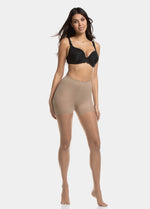 Front view of a model wearing Spectacular Legs in sunkissed, 20 denier shaping tights. Built-in firm shaping shorts providing control for tummy, hips, and upper legs, with subtle lift at the bottom and smooth sheer finish on the legs.