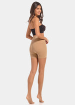 Back view of a model wearing Summer Tights in sunkissed, 20 denier shaping tights with open toe styling. Built-in firm shaping short providing control for lower back, hips, and upper legs, with subtle lift at the bottom and slimming leg effect visible.