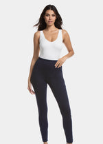 Front view of a model wearing Jegging in blue jeans, high-waist skinny-fit leggings with built-in shaping briefs. Soft stretchy fabric providing medium shaping for tummy, hips, and back, with cotton gusset, lifted bottom zone, and faux front pockets visible.
