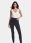 Front view of a model wearing Jegging in blue jeans, high-waist skinny-fit leggings with built-in shaping briefs. Soft stretchy fabric providing medium shaping for tummy, hips, and back, with cotton gusset, lifted bottom zone, and faux front pockets visible.
