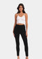 Front view of a model wearing Suedine Look Legging in black, high-rise leggings with built-in shaping briefs. Soft luxurious faux suede stretch fabric providing medium shaping for tummy, hips, and back, with cotton gusset visible.